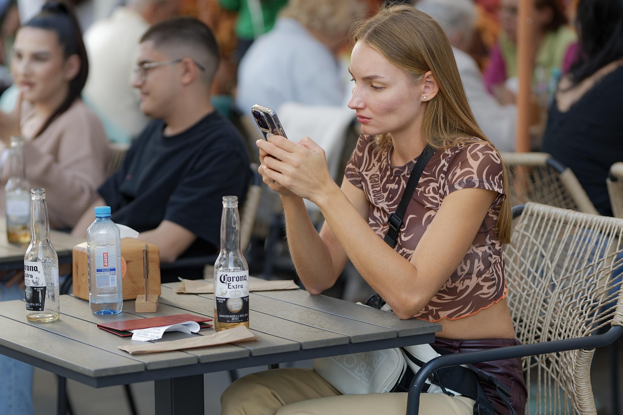 Diner scanning a QR menu at a restaurant table