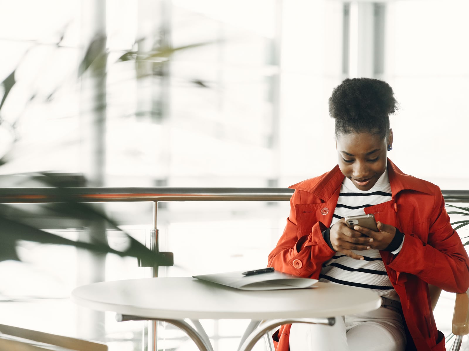 A young woman working with her phone