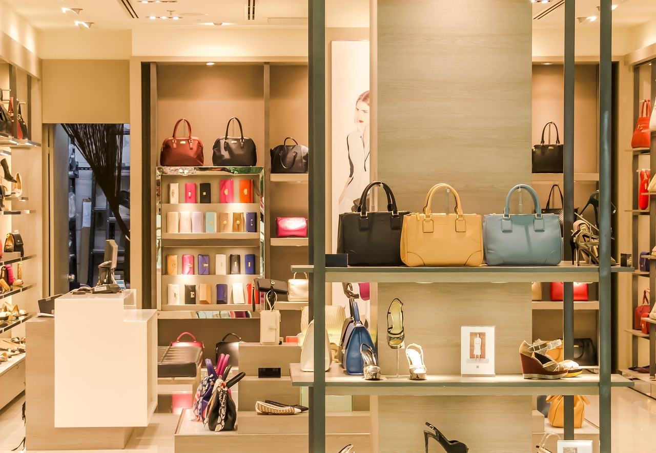 Bags and accessories on a boutique shelf